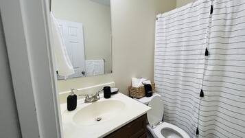Combined shower/tub, hair dryer, towels, soap