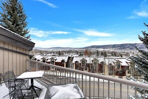 Enjoy breathtaking views of the surrounding mountains from this balcony.