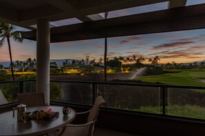 Enjoy a peaceful evening on the balcony overlooking the golf course and distant mountains.