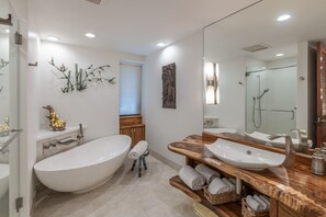 Bathtub, hair dryer, towels, shampoo