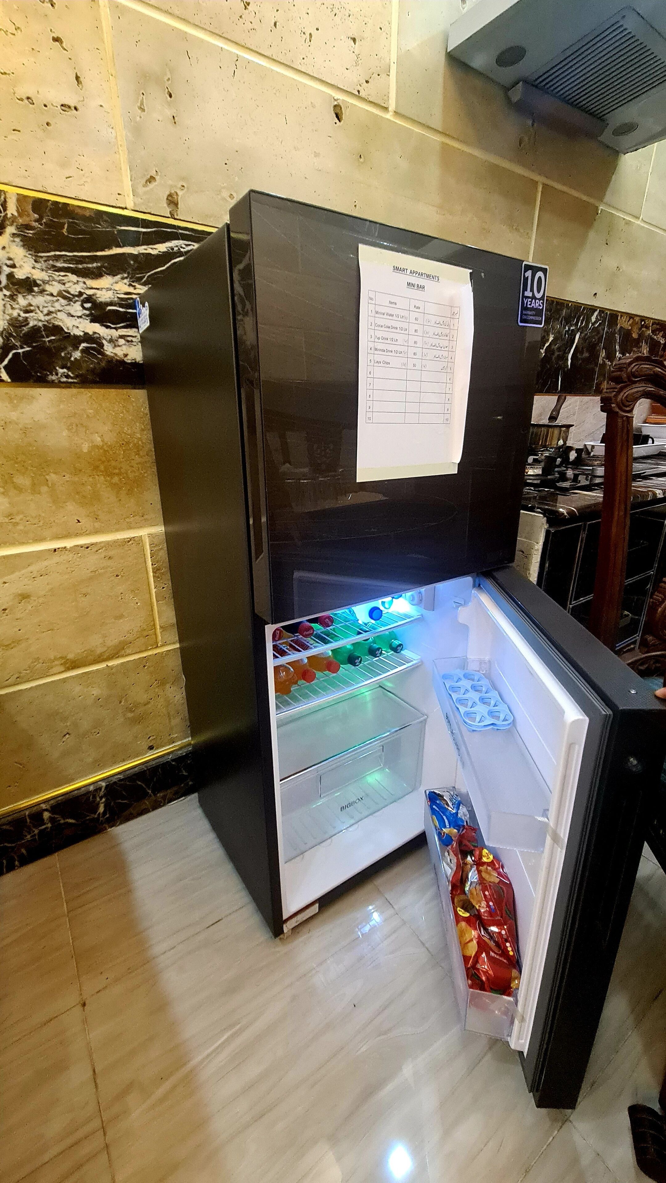 basic studio, 1 bedroom | private kitchen | full-sized fridge, cookware/dishes/utensils, freezer, kitchen islands