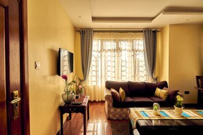 Suite Deluxe | Sala d'estar | Televisor LED