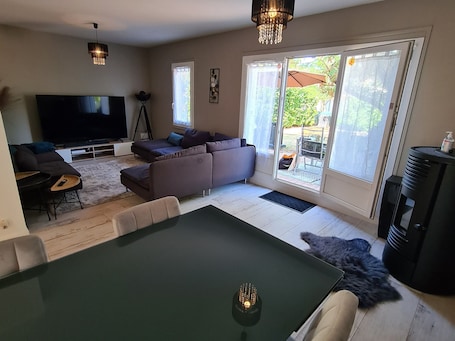 TV, fireplace. "Charming 3-Bedroom Cottage with Jacuzzi, Near Loire and Forest, Ouzouer-sur-Loire"