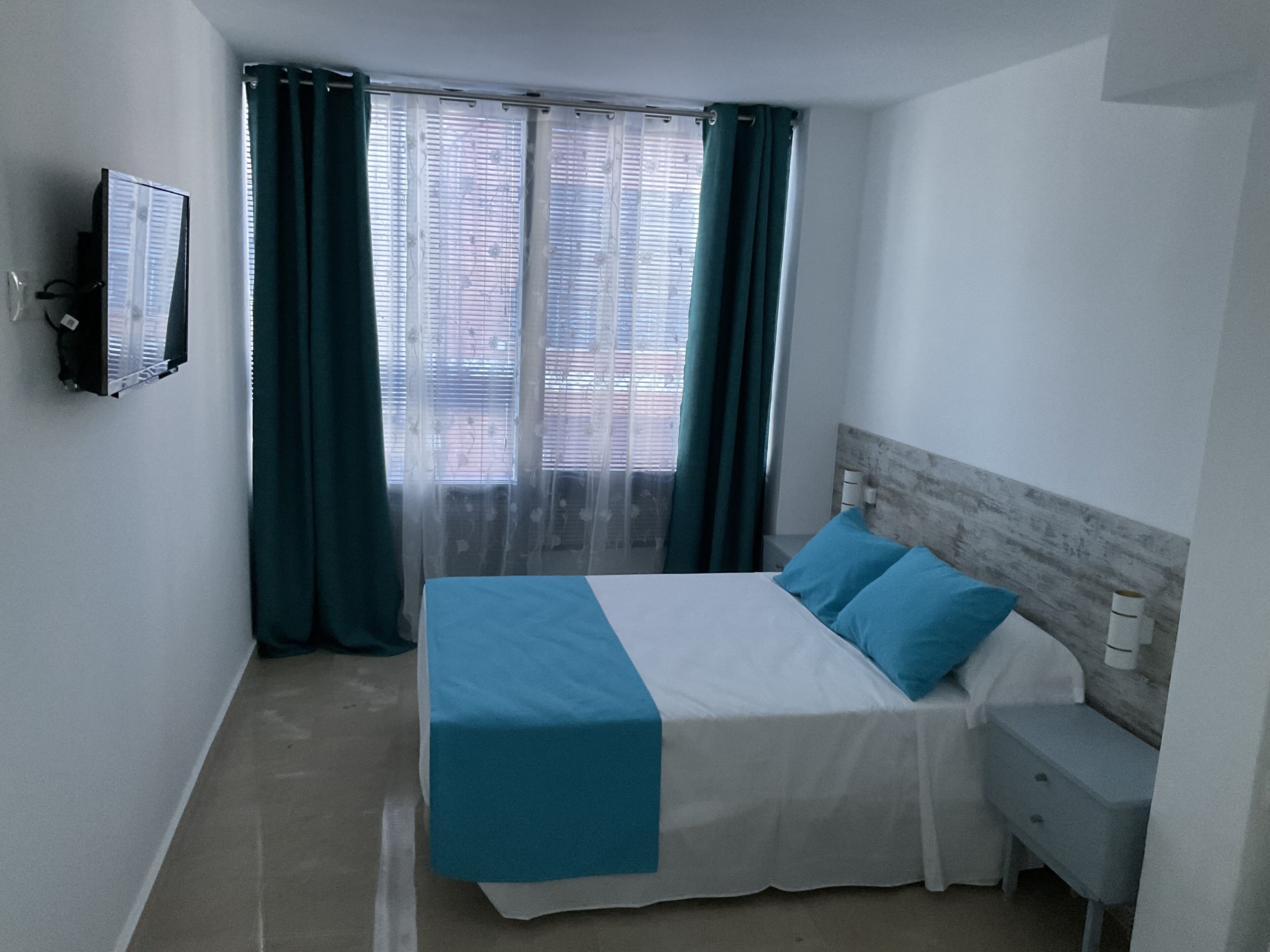 Blue Capri | Blackout curtains, free WiFi, bed sheets