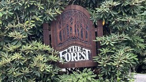 A sign for 'The Forest' with a private road notice. - Spacious suite surrounded by nature with living room, fireplace, porch, fire pit (Blowing Rock)