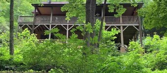 Spacious suite surrounded by nature with living room, fireplace, porch, fire pit