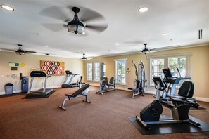 A gym with treadmills, elliptical machines, and free weights. - Welcome to La Vista! (St. George Island)