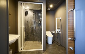 A modern bathroom with a glass-enclosed shower, a white sink, and a toilet. - fav KAGOSHIMA CHUO (Kagoshima)