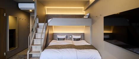 A bunk bed room with a wooden staircase, a flat-screen TV, and a ceiling-mounted air conditioner.