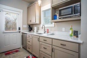 Fridge, microwave, coffee/tea maker, toaster