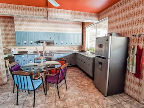 Fridge, microwave, cleaning supplies