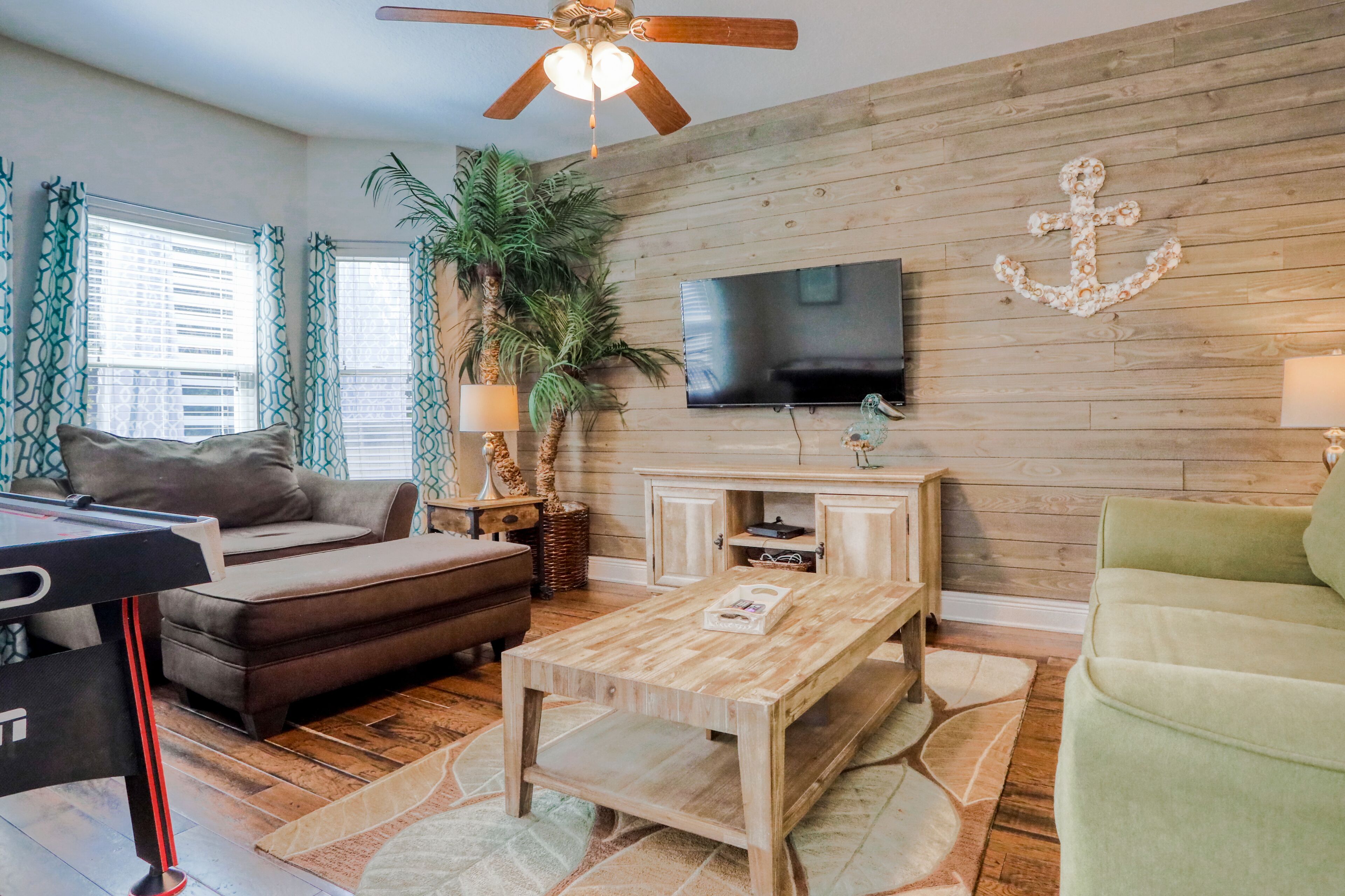 Coastal retreat with pool, hot tub, golf cart, patio, grill, & air hockey