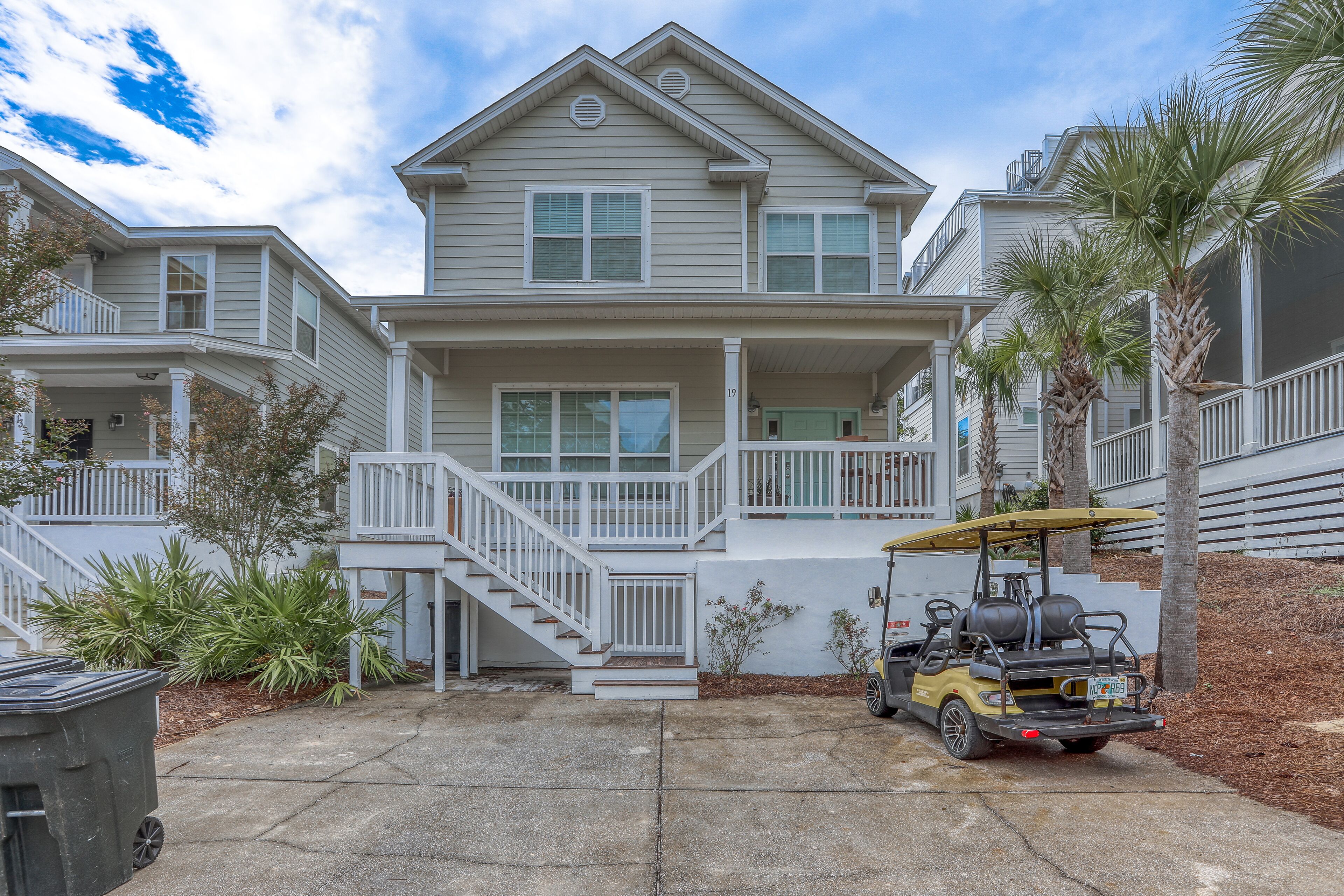 Coastal retreat with pool, hot tub, golf cart, patio, grill, & air hockey