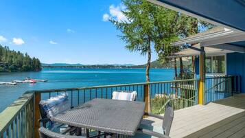 Relax on the deck overlooking the serene lake, where you can dine or unwind in a peaceful setting.