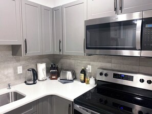 Fridge, microwave, oven, stovetop - Affordable Luxury – 2-Bedroom Suite in Wolf Willow, Calgary! (Calgary)