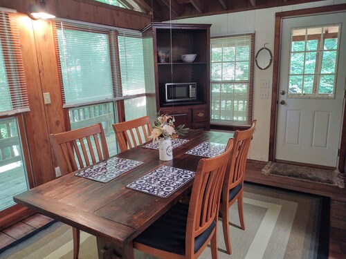 Authentic log cabin nestled in the woods by creek