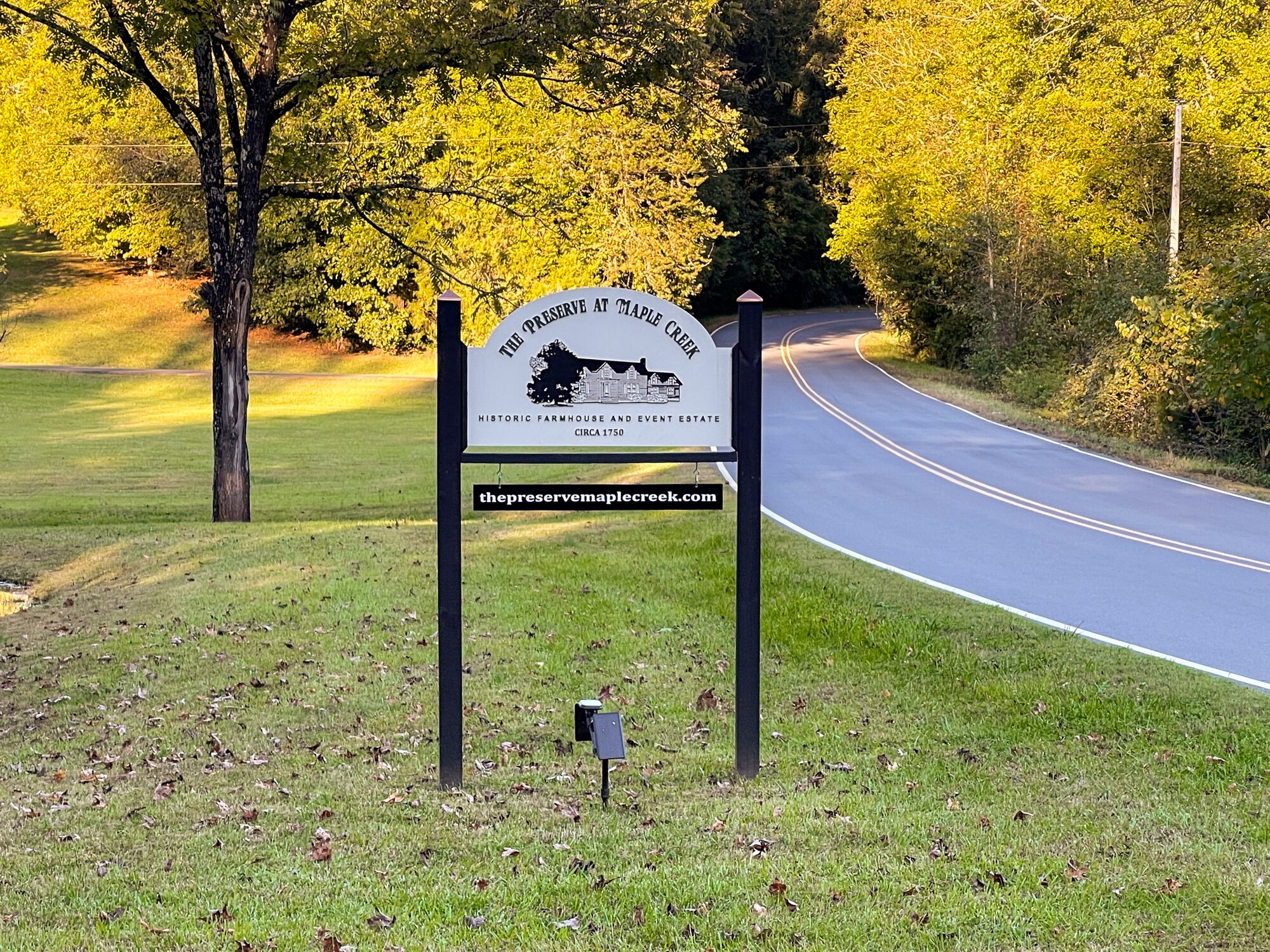 A sign for The Preserve at Maple Creek, a historic farmhouse and event estate dating back to circa 1750.