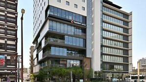 A modern hotel with multiple floors, large windows, and a prominent sign for Comfort Hotel. - Comfort Hotel Yokkaichi (Yokkaichi)