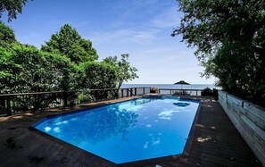 Outdoor pool, a heated pool - Spacious 5-Bedroom Waterfront Oasis with Private Dock, Pool and Hot Tub (Tracys Landing)