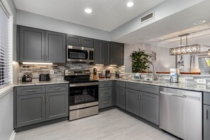 Villa, 2 Bedrooms | Private kitchen | Oven, dining tables