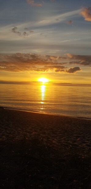 On the beach, sun loungers, beach towels - 1932 Charming Cottage at the Lake (ontonagon)