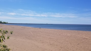 On the beach, sun loungers, beach towels