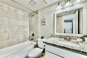 Combined shower/tub, hair dryer, towels, soap
