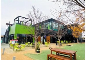 Guests can sit and enjoy the green surroundings from the outdoor seating area.