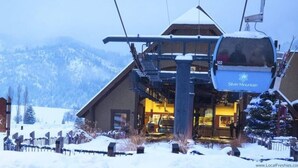A ski lift at Silver Mountain Resort with a sign for the ski waterpark and golf.