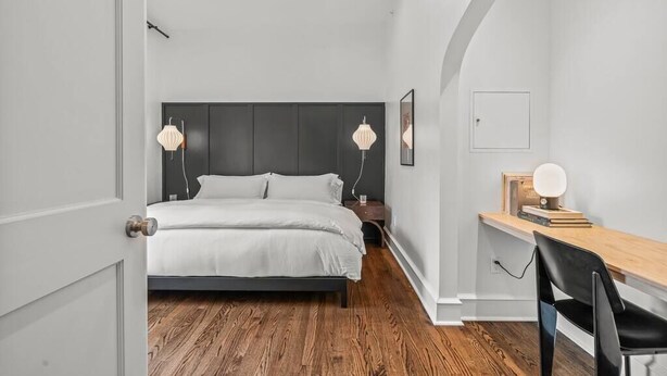 A modern bedroom with a bed, bedside tables, a desk, and a chair. - Luxury in Ritt Sq. | Parking | Hosted By StayRafa (Philadelphia)