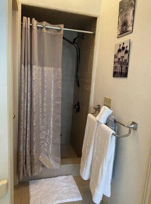 Shower, hair dryer, towels, soap