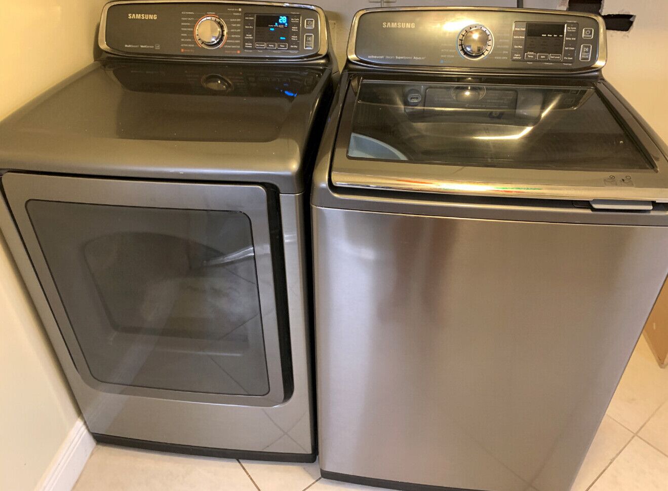 A front view of a Samsung front-loading washer and dryer unit.