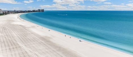 On the beach, sun-loungers, beach towels