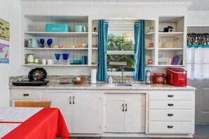 Fridge, microwave, stovetop, coffee/tea maker