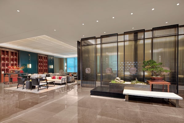 Welcome to our lobby, where a comfortable reception area and seating space await.