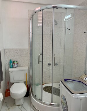 Shower, towels, toilet paper
