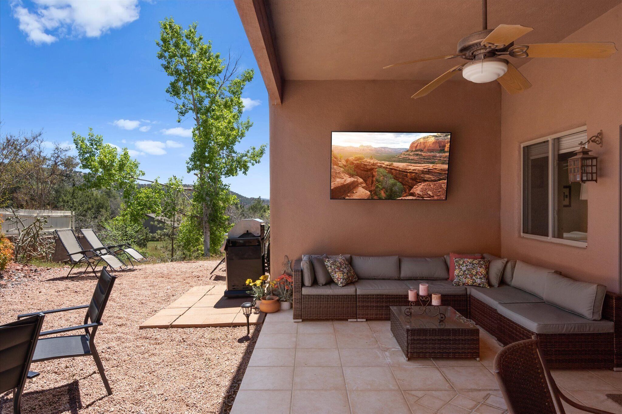 Experience the indoor comfort and outdoor beauty on the large back patio lounge.