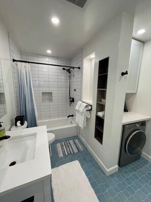 Combined shower/bathtub, hair dryer, towels, soap