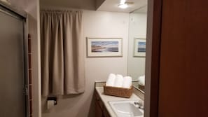 Bathtub, hair dryer, towels, soap