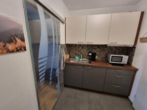 Fridge, microwave, toaster, cookware/dishes/utensils