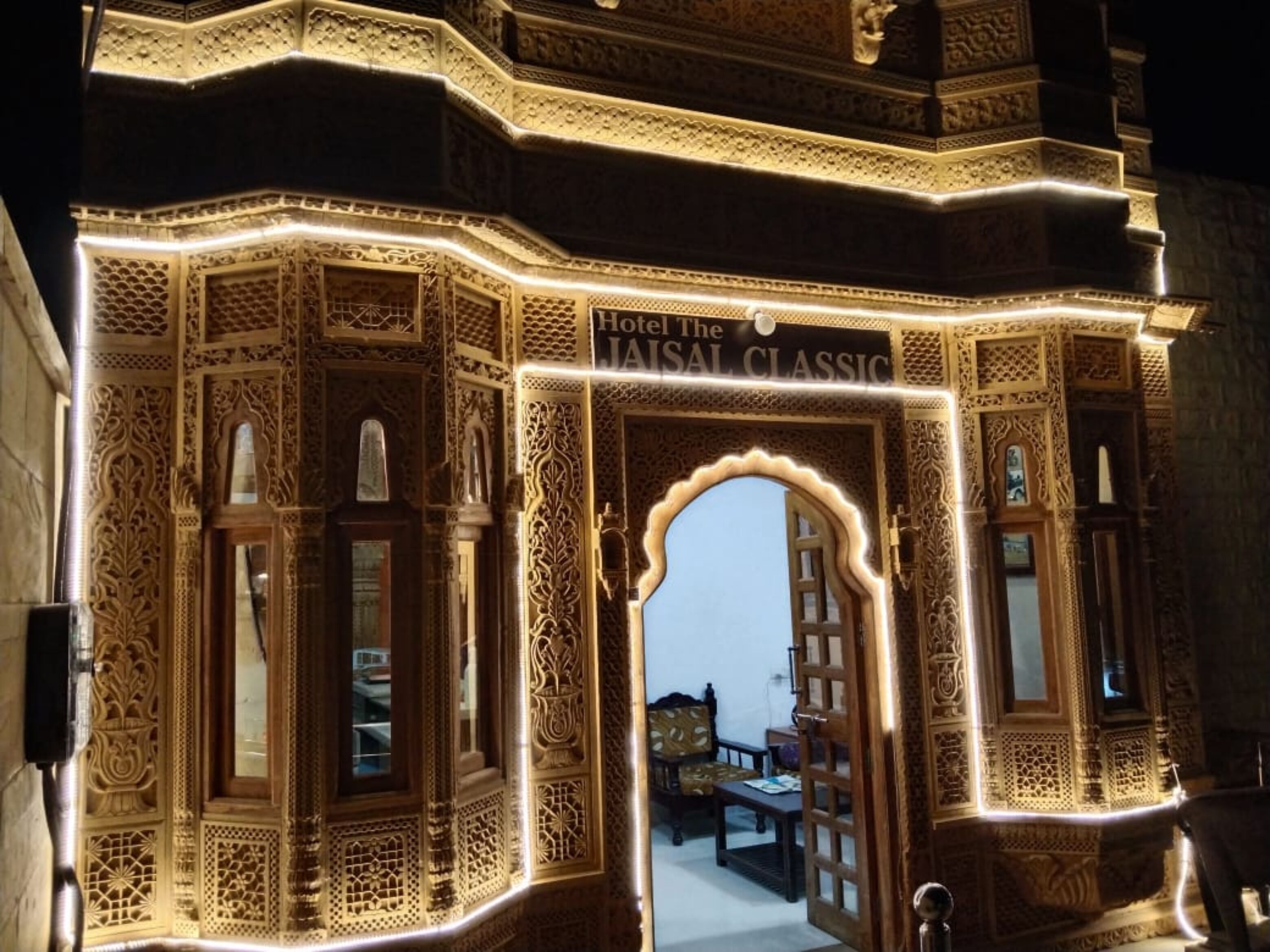An ornate entrance with intricate carvings and a sign reading "Hotel The Lajas Classic".