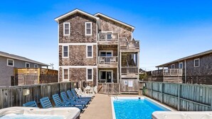 A two-story building with a pool and hot tubs. - 6151 Once Upon a Tide * Almost Oceanfront (Nags Head)