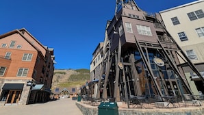 A multi-story building with a unique architectural design, featuring a prominent tower structure and multiple windows. - Oversized | Walk to Summer Fun | Pool & Hot tub (Keystone)