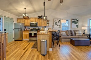 Smart TV, fireplace, books, computer monitors