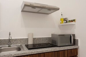 Fridge, microwave, stovetop, coffee/tea maker