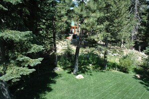 Escape to a serene garden, surrounded by lush trees and a tranquil atmosphere, perfect for relaxation or outdoor activities.