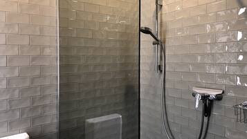 Shower, rainfall showerhead, towels