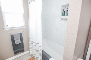 Combined shower/tub, hair dryer, towels, soap