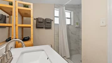 Shower, hair dryer, towels, soap