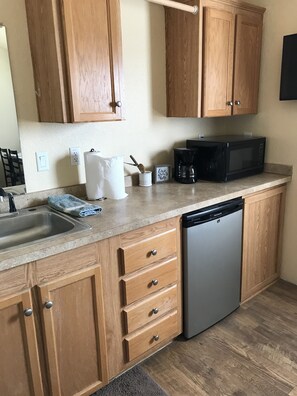 Fridge, microwave, stovetop, coffee/tea maker